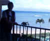 Cheryl on the balcony with Molokai in the back, on Maui