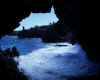 Crashing waves at the mouth of the cave