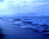 Surf crashing on Polihale with the Forbidden island of Niihau in background